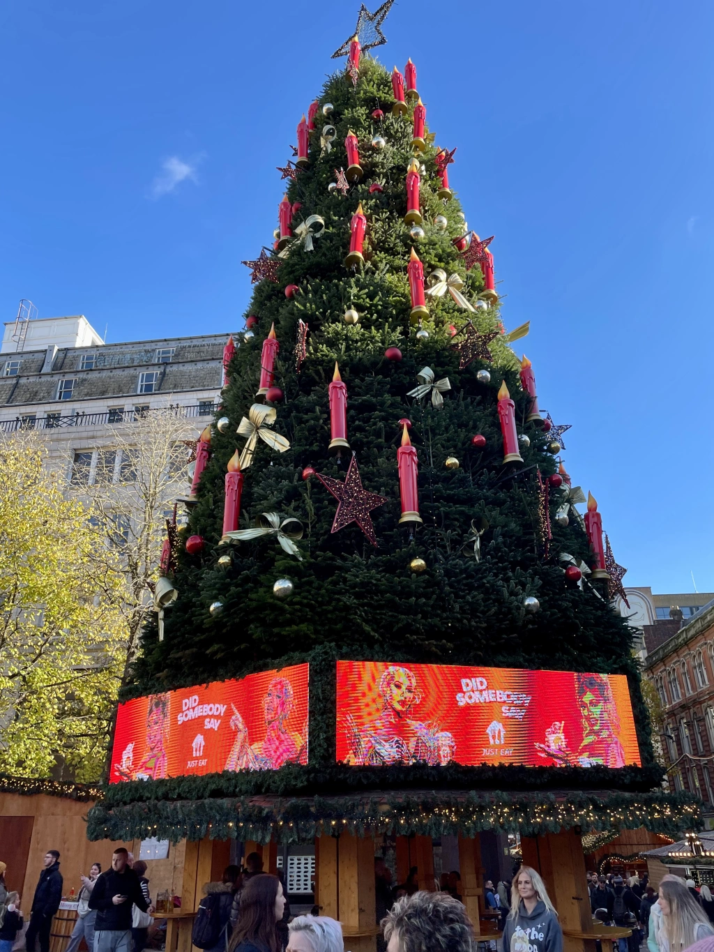 a christmas tree with advertisements