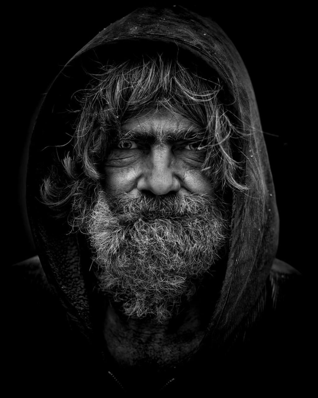 hooded homeless bearded man monochrome photo